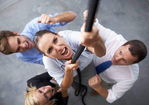 Office, people and woman climbing rope with effort, motivation and staff trust in team member for agency growth. Community, top view and professional person with determination, support and commitment. model released property released Copyright: xPeopleImages.comx-x 52789b531d478x
