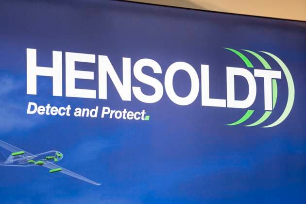 Augsburg, Swabia, Bavaria, Germany - October 11, 2024: Hensoldt AG logo of the defense, security, aviation and aerospace company at the Augsburg CSU Party Day. *** Hensoldt AG Logo der Firma für Rüstung bzw. Rüstungskonzern, Bereichen Verteidigung, Sicherheit, Luftfahrt und Raumfahrt, auf dem Messestand beim Augsburger CSU Partei Tag.