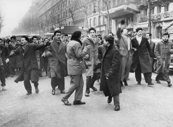 Orig. caption... WHEN RIGHT AND LEFT MEET. In Paris yesterday there was a clash between two groups of students in the Latin Quarter. Members of the new union of french students from Algeria, after laying a wreath on the war memorial, marched along the Boulevard St. Michel and clashed with another group of students coming from the Sorbonne, who greeted them with cries of Fascism will not pass! A short sharp struggle ensued, in which some blood flowed but little serious damage was done. Belts, clubs and fists were used. Five arrests made. Photo shows. The demonstrators in Rude Place de la Sorbonne, shouting their slogans, before clashing with the rival faction in Rue Victor Cousin. Note The Algerian Revolt - struggle 1954-1962 for liberation  Copyright: xx STUDENT DEMONSTRATION IN PARIS
