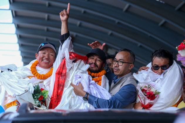 Record Holding Mountain Climbers Gets Rousing Welcome Upon Arrival Back Home Record-setting climber Nirmal Purja, also known as Nimsdai, signals victory as he arrives back in Kathmandu, Nepal, on October 14, 2024, after completing the summit of 14 peaks towering above 8000 meters without oxygen. On May 7, 2022, climber Nims begins this campaign by summiting Kanchenjunga without using supplemental oxygen. On May 27 of the same year, he ascends Everest, followed by Lhotse on May 28, Makalu, Cho Oyu, Dhaulagiri, Annapurna, Manaslu, Nanga Parbat, Gasherbrum, Broad Peak, and finally Shishapangma. Out of the 14 tallest peaks, eight are located in Nepal, while the others are in Pakistan and China. Kathmandu Nepal  Copyright: xSubaasxShresthax originalFilename: shrestha-recordho241014_np8zh.jpg