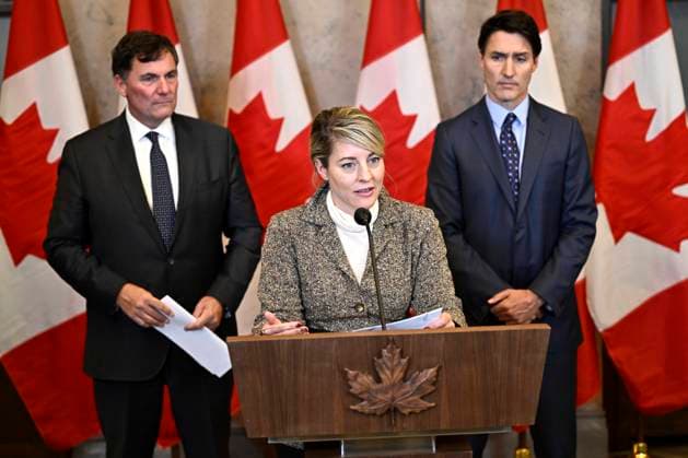 October 14, 2024, Ottawa, On, CAN: Minister of Foreign Affairs Melanie Joly, centre, Prime Minister Justin Trudeau, right, and Minister of Public Safety, Democratic Institutions and Intergovernmental Affairs Dominic LeBlanc participate in a news conference on the investigative efforts related to violent criminal activity occurring in Canada with connections to India, on Parliament Hill in Ottawa, on Monday, Oct. 14, 2024. Ottawa CAN - ZUMAc35_ 20241014_zaf_c35_050 Copyright: xJustinxTangx