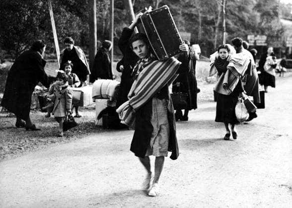 Orig. caption... FRANCE OPENS HER FRONTIERS TO REFUGEES. There were pitiful scenes at the French frontiers town of Le Pertros, when some of the thousands of refugees from Barcelona and districts began to be admitted by the authorities. The picture shows young and old, men & women, carrying their household goods the last few steps to the frontier which will take them to peace and freedom. Note Spanish Civil War - armed conflict between right-wing and left-wing forces in Spain 1936-39. The war began with a revolt against the incumbent Popular Front government. The right-wing forces (rebels), the Falange, with its leader General Franco, were supported by Italy and Germany. The government was supported by the left and volunteers from abroad in  Copyright: xXxXxXx SPANISH REFUGEES