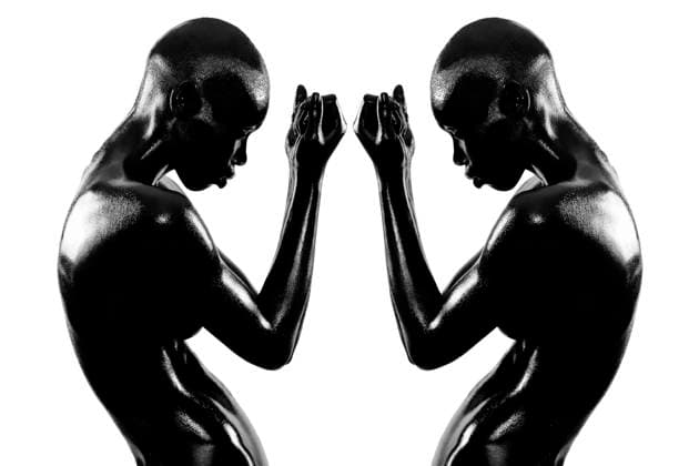 Creative Highlights Symbolfotos Silhouetted image of two muscular women against a white background, reflecting each other in a symmetrical pose krst00440 Copyright: xConnectxImagesx ,model released