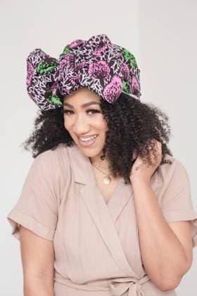 Creative Highlights Symbolfotos Woman smiling and touching curly hair with a headwrap San Francisco, California, United States R_HOOX241015B-1517626-01 ,model released, Symbolfoto