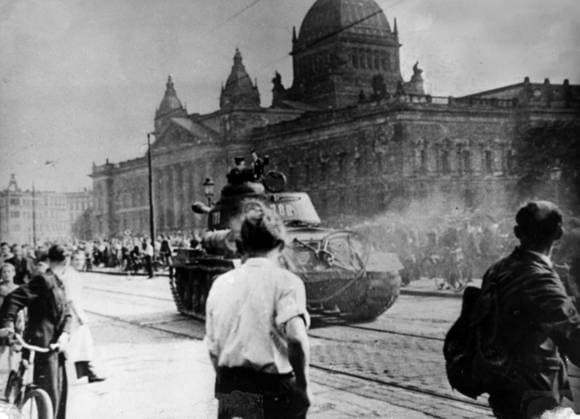 Orig. caption... FIRST PICTURES FROM EAST GERMANY OF 17th JUNE RIOTS The first pictures taken in east-Germany of the riots of the 17th June have just been smuggled out to the west. Photo shows: The first Russian troops to attempt to quell the riots drive through the streets of Leipzig in tanks. Orig. caption... FROM THE LEIPZIG JUNIOR ILLEGALITY comes this smuggled image. Across Augustusplatz, a Russian tank came rushing to disperse the crowd in front of the Supreme Court building and the University. Unexpectedly, the Russians open fire on the crowd, and it was at the risk of his own life that the photographer took the exclusive photo. Note CD37.182.7 Demonstration sites: LEIPZIG; EAST GERMANY sp_sw x5600x *** Orig caption FIRST PICTURES  Copyright: xXxXxXx REBELLION IN EAST GERMANY 1953