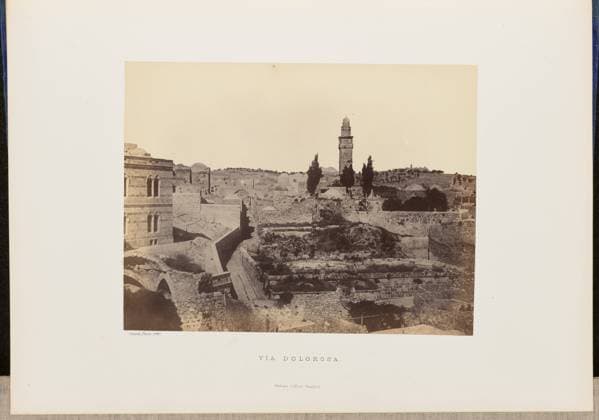 RECORD DATE NOT STATED Via Dolorosa. John Cramb, photographer (Scottish, active 1850s - 1860s) 1860 Elevated view of Jerusalem with the Via Dolorosa snaking through buildings and ruins. Ghawanima minaret, one of the four minarets of Temple Mount, rises above the city buildings in the center of the image. (Recto, mount) lower left, below print, letterpress in black ink: Cramb, Photo. 1860. Lower center, letterpress in black ink: VIA DOLOROSA. William Collins, Glasgow. (Verso, mount) lower left, handwritten in pencil: IB 51.17 (CRA) Copyright: xpiemagsx piemagsrmnb13020224-3565 !ACHTUNG AUFNAHMEDATUM GESCHÄTZT!