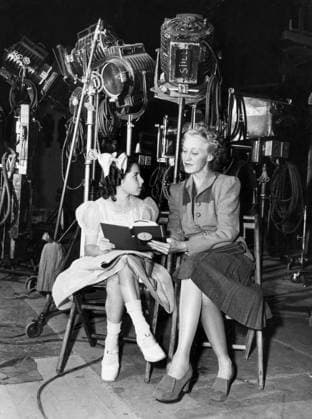 Orig. caption... SCHOOL FOR STARS Sound Learning. Director of Education on the Warner lot is Miss Lois Horn. She is shown going over a lesson with Sylvia Arsland, who played Bette Davis daughter in Mr. Skeffington. Miss Horn frequently visits the sound stage like this to conduct class since the shooting schedule does not always permit attendance at the schoolroom. Note See also BBD685, BBK549-BBK551 and BBR939 Image series Photo report Lessons Conversations Child actors CD647 persons: SYLVIA ARSLAND;LOIS HORN sites: USA sp_sw x5600x *** Orig caption SCHOOL FOR STARS Sound Learning Director of Education on the Warner lot is Miss Lois Horn She is shown going over a lesson with Sylvia Arsland, who played Bette Davis daughter in Mr Skeffingt  Copyright: xx SCHOOL FOR STARS