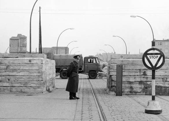 Orig. caption... THREE BERLINERS BREAK THROUGH WALL Three young men from East Berlin battered their way through the dividing wall on April 18 by using a heavy lorry loaded with sand. The break-through was made in Heinrich Heine Strasse in the Kreuzberg district. Unfortunately the men ran into gun fire and the driver lost his life. Before he died he hung on to the steering wheel and made sure the wall was breached. Both his companions were hurt - one was wounded in the shoulder, and the other hurt his back badly. They are now in a West Berlin hospital. A few hours after the breakthrough, which was at night, the East Berlin police brought up a crane and repaired the damage with new concrete blocks. This picture shows the gap, which has been t  Copyright: xXxXxXx ZONE BOUNDARY