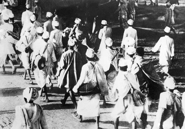 Orig. caption... INDIAN REVOLUTIONARY LEADER ON HIS MARCH OF INDEPENDENCE Mahatma Gandhi, the Indian revolutionary leader - is now on his great March of Independence, which started from Ahmedabad to the Gulf of Cambay, a distance of over 100 miles. Gandhi who has with him a pioneer band of 72 civil resistance volunteers, is marching to the Coast to prepare Salt in the Salt Mines which are controlled by the British Government. This is his first step in his great campaign of civil disobedience against civil rule in India. It is expected that at the end of the great March, the Indian leader will be arrested. O.P.S. Some of Gandhi s followers, in the great procession of the March of Independence at the start from Ahmedabad. The procession at so  Copyright: xXxXxXx THE SALT MARSH