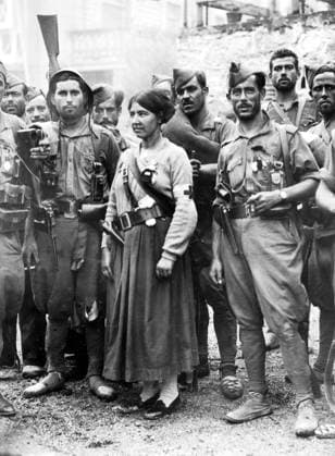 Orig. caption... IRUN FALLS TO THE NATIONAL REBELS. Irun is now a blackened and charred city, but the National Rebel troops are now in possession. They went round the city in sorties on a mopping up expedition as there is still some sniping going on from the few remaining Reds who are entrenched in famhouses etc. O.P.S. Members of the Spanish Foreign Legion (National Rebeltroops) photographed having a smoke when they entered IRUN. With them is the only Red Cross nurse who entered the city. Note the pistol she wears in her belt. Note Spanish Civil War - armed conflict between right-wing and left-wing forces in Spain 1936-39. The war began with a revolt against the incumbent Popular Front government. The right-wing forces (rebels), the Falang  Copyright: xXxXxXx SPAIN 1936