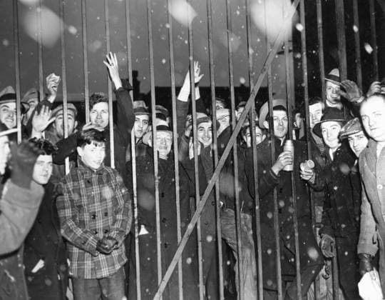 Orig. caption...STAY-IN STRIKER TIE UP NEW JERSEY STEEL COMPANY Some of the strikers who took possession of the Crucible Steel Company Plant at Harrison, N.J., Jan. 17th, are shown behind the barred gates of the plant, waving to their friends on the outside of the gates. They staged their stay-in strike over the alleged violation by the company of their CIO contract. The strike effecting 2,000 workers, was called by the Steel Workers Organizing Committee, a CIO affiliate. One hundred strikers left the plant the same night at the request of the Harrison Chief of Police, Peter F. Bradby, who promised that Strike-breakers would not be given their jobs if they left voluntarily. Note Fence Smile Thermoses Congestion CD483 sites: USA;NEW JERSEY  Copyright: xx STRIKING STEEL WORKERS