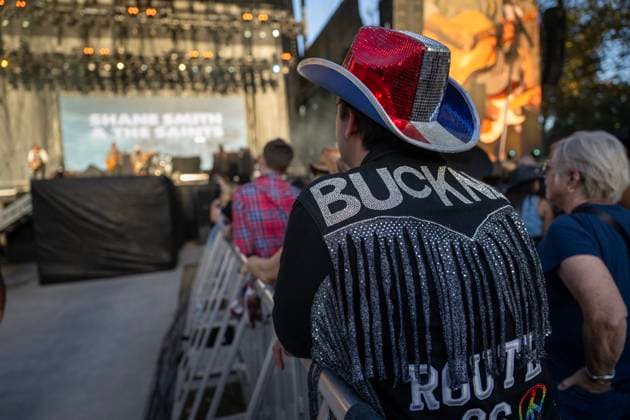 October 18, 2024, Sacramento, Ca, USA: Trevor Buckner wears a custom jacket with his name listening to Shane Smith & The Saints during the Golden Sky Music Festival at Discovery Park on Friday, Oct. 18, 2024 in Sacramento. Sacramento USA - ZUMAj89_ 20241018_zaf_j89_007 Copyright: xPaulxKitagakixJr.x