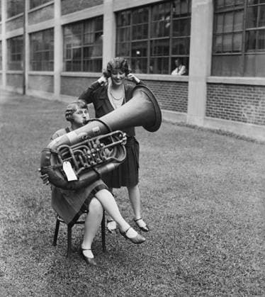 RECORD DATE NOT STATED Woman Playing Tuba While Another Woman is Plugging her Ears, USA, circa 1928 Woman Playing Tuba While Another Woman is Plugging her Ears, USA, circa 1928. Copyright: 1010_16_ghi-circa01117