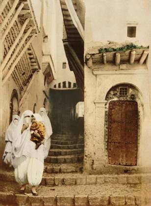 RECORD DATE NOT STATED Veiled Women with Child, Street of the Camels, Algiers, Algeria, Photochrome Print, circa 1900 Veiled Women with Child, Street of the Camels, Algiers, Algeria, Photochrome Print, circa 1900. Copyright: 1010_16_ghi-circa01367