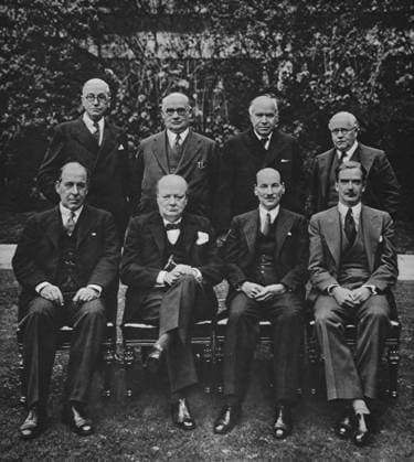 RECORD DATE NOT STATED Mr Churchill with his war cabinet. The Illustrated London News 1941. World war II. Mr Churchill with his war cabinet. Left to right ( Standing ) Mr Arthur Greenwood, Minister without Portfolio; Mr Ernest Bevin, Minister of labour and National Service, Lord Beaverbrook, Minister of supply; Sir Kingsley Wood, Chancellor of the exchequer. . Copyright: 902_05_12332211HighRes