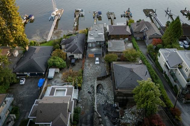 October 22, 2024, North Vancouver, Bc, CANADA: Multiple homes are seen surrounded by debris left by flooding from torrential rain from an atmospheric river weather system at Deep Cove in North Vancouver, on Tuesday, October 22, 2024. North Vancouver CANADA  - ZUMAc35_ 20241022_zaf_c35_130 Copyright: xEthanxCairnsx