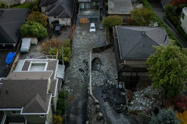 October 22, 2024, North Vancouver, Bc, CANADA: Multiple homes are seen surrounded by debris left by flooding from torrential rain from an atmospheric river weather system at Deep Cove in North Vancouver, on Tuesday, October 22, 2024. North Vancouver CANADA  - ZUMAc35_ 20241022_zaf_c35_131 Copyright: xEthanxCairnsx