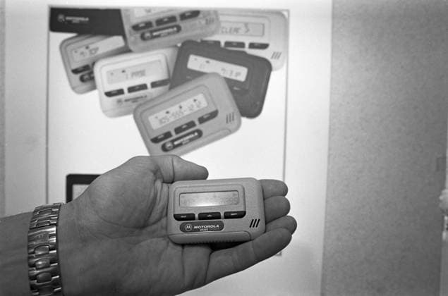 Exhibition of Motorola, America 8785005 14.10.1992 Exhibition of Motorola, American company (abolished in 2011) on the Russian market. The beep device reminds the owner where to immediately call. Sergey Subbotin Moscow Russia  Copyright: xSergeyxSubbotinx