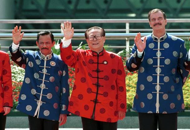 Chinese President Jiang Zemin (C) waves to the press during the traditional photo call when the leaders wear their Apec jackets at the Leaders retreat during the Asia-Pacific Economic Co-operation ( Apec ) summit meetings in Shanghai , China. With him are Brunei Darussalam leader Sultan Haji Hassanal Bolkiah (L) and Mexican President Vicente Fox (R). (Pool Pix for HK Press) ***NOT FOR ADVERTISING USE*** SHANGHAI CHINA EDITORIAL USE ONLY  Copyright: xx 065c719a61aa4d348acc6ca8ab57593e MarkxRalstonx scmpphotostwo020111