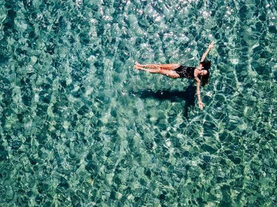 Young girl in a black swimsuit swims in the sea. DCIM100MEDIADJI_0114.JPG ,model released, Symbolfoto Copyright: xZoonar.com OleksiixHrecheniukx 12680349 ,model released, Symbolfoto ,property released