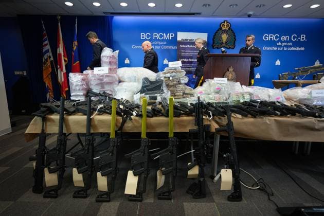 October 31, 2024, Surrey, Bc, CANADA: Firearms and illicit drugs seized last week are displayed as RCMP Chief Supt. Stephen Lee, back from left to right, Asst. Commissioner David Teboul, Insp. Jillian Wellard and Cpl. Arash Seyed leave after a news conference at RCMP headquarters, in Surrey, B.C., on Thursday, October 31, 2024. The RCMP says they have dismantled the largest and most sophisticated fentanyl and methamphetamine drug superlab in Canada, after an operation was conducted in Falkland, B.C., and Surrey beginning last Friday. Surrey CANADA - ZUMAc35_ 20241031_zaf_c35_074 Copyright: xDarrylxDyckx