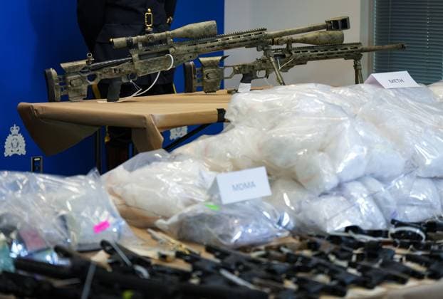 October 31, 2024, Surrey, Bc, CANADA: Firearms, including a .50-calibre machine gun, and illicit drugs that were seized last week are displayed before a news conference at RCMP headquarters, in Surrey, B.C., on Thursday, October 31, 2024. The RCMP says they have dismantled the largest and most sophisticated fentanyl and methamphetamine drug superlab in Canada, after an operation was conducted in Falkland, B.C., and Surrey beginning last Friday. Surrey CANADA - ZUMAc35_ 20241031_zaf_c35_093 Copyright: xDarrylxDyckx