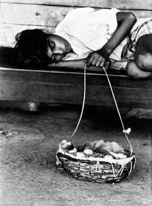 Boy sleeping and holding a basket, India Copyright: xTxSatyan DinodiaxPhotox