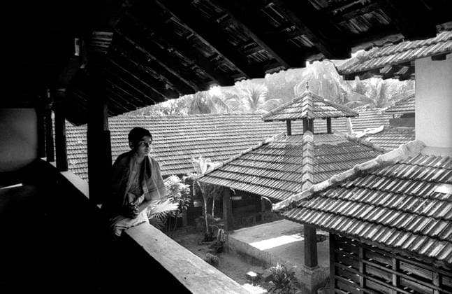 Boy seating on balcony wall, India Copyright: xTxSatyan DinodiaxPhotox
