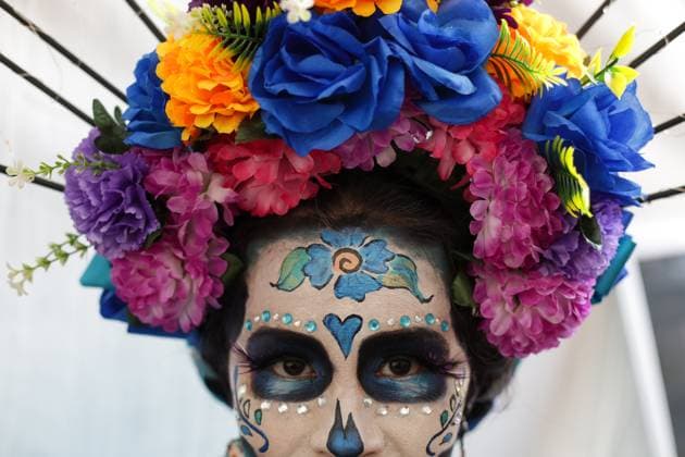 (241103) -- MEXICO CITY, Nov. 3, 2024 -- A dressed-up woman participates in the Day of the Dead Parade in downtown Mexico City, capital of Mexico, on Nov. 2, 2024. (Photo by Xinhua) MEXICO-MEXICO CITY-DAY OF THE DEAD-PARADE FranciscoxCanedo 