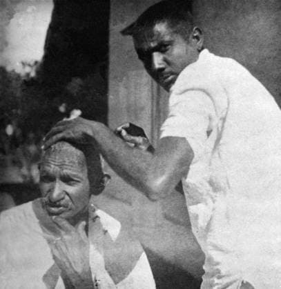 Mahatma Gandhi getting shaved during the salt march, March 1930 - MODEL RELEASE NOT AVAILABLE Copyright: xVithalbhaixJhaveri DinodiaxPhotox