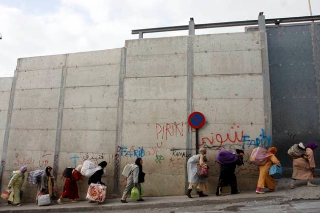 0000752.- Porteadoras en el Tarajal. CEUTA, Spain (29 05 09).- Two Moroccan women were crushed to death and twelve more people were injured, including four police officers, in an avalanche of people at a border trading post between Ceuta and Morocco last May 25th. The Biutz bridge was opened two years ago to ease the traffic of people and goods between the two countries and to concentrate all import-export traffic in one place for customs purposes. Andres Carrasco ALFAQUI EL TARAJAL SPAIN EDITORIAL USE ONLY Copyright: xx AndresxCarrascoxx xALFAQUIx dpphotos110573