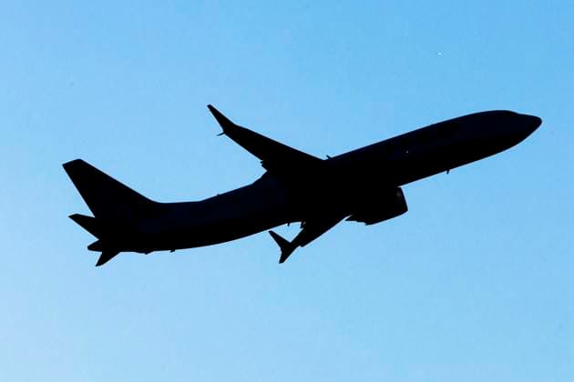 United Airlines Boeing 737 MAX 8 Silhouette of the isolated aircraft, passing in front of the sun. United Airlines Boeing 737 MAX 8 aircraft spotted departing from LaGuardia Airport in New York City during take off and flying phase in the air with the airport terminal and the air traffic control tower in the background. The passenger airplane has the registration tail number N27270 and is powered by 2x CFMI LEAP-1B jet engines. United Airlines Inc is a major airline in the USA, headquartered at Willis Tower in Chicago, Illinois. United is one of the largest airlines in the world with a fleet of 977 planes, member of Star Alliance aviation group. LaGuardia Airport LGA is an airport located in Queens, New York City, United States of America.  Copyright: xNicolasxEconomoux originalFilename: economou-notitle241108_np6Xd.jpg