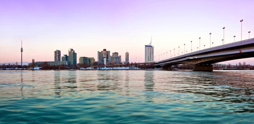 Skyline Danube City Vienna Gently colored Skyline of Danube City Vienna next to the Reichsbrücke (german for Empire Bridge). In the near future the highest building of vienna will take place in this skyline. The construction works has been started not so long ago. Current activities are some building cranes on the construction site. Copyright: xZoonar.com Ing.xSchiederxMarkusx 5967131