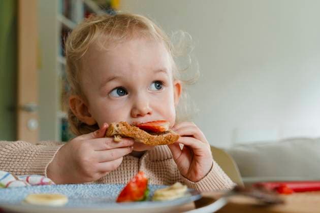 Thoughtful cute boy having breakfast at home model released, Symbolfoto property released, NDEF02001