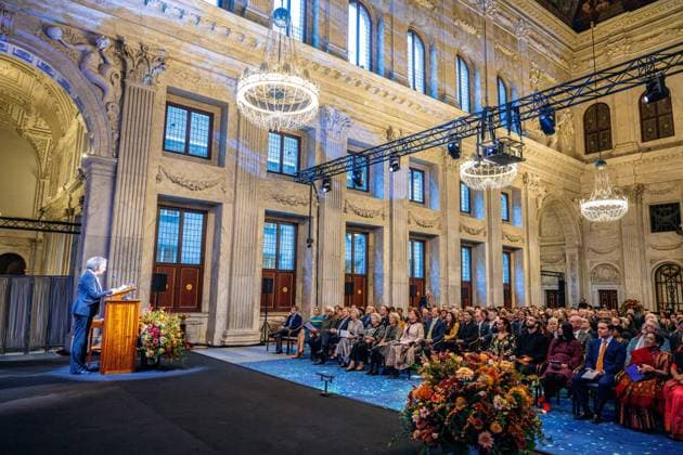 Amsterdam, The Netherlands, 2024-11-26 15:59:32 AMSTERDAM, 26-11-2024, Royal Palace AmsterdamKing Willem Alexander presents the Erasmus Prize to Indian writer Amitav Ghosh (Kolkata, 1956) at the Royal Palace Amsterdam. The King is a patron of the Praemium Erasmianum foundation. PHOTO: NLBeeld Patrick van Emst Credit: NL Beeld Patrick van Emst  Copyright: xx x