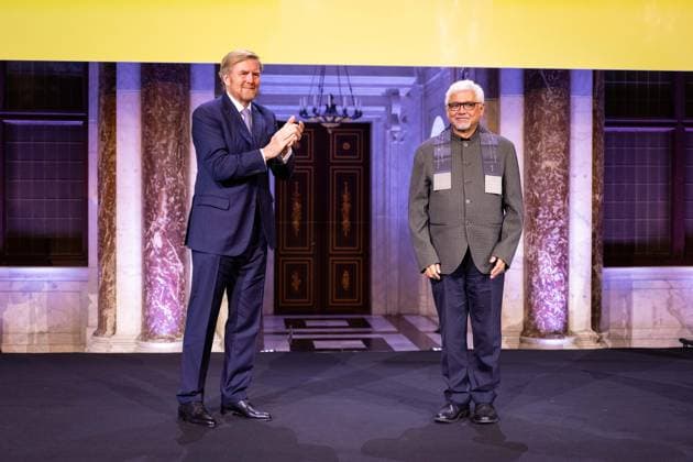 Amsterdam, The Netherlands, 2024-11-26 16:30:48 AMSTERDAM, 26-11-2024, Royal Palace AmsterdamKing Willem Alexander presents the Erasmus Prize to Indian writer Amitav Ghosh (Kolkata, 1956) at the Royal Palace Amsterdam. The King is a patron of the Praemium Erasmianum foundation. PHOTO: NLBeeld Patrick van Emst Credit: NL Beeld Patrick van Emst  Copyright: xx x