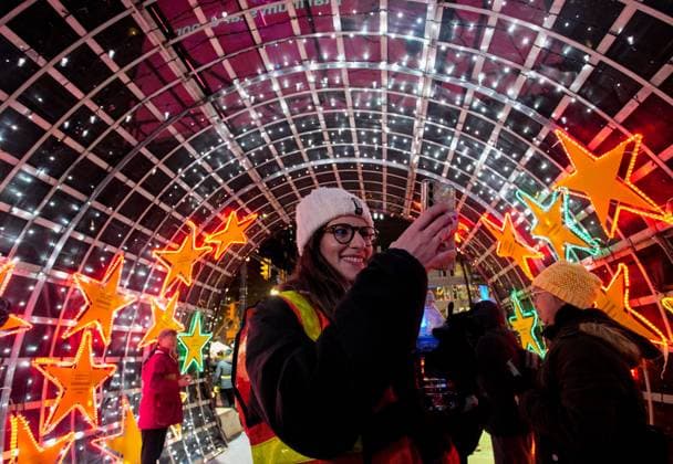 (241128) -- VANCOUVER, Nov. 28, 2024 -- A woman takes photos of the Christmas lights during the Lights of Hope lighting ceremony in Vancouver, British Columbia, Canada, Nov. 27, 2024. Lights of Hope is one of Vancouver s largest annual Christmas fundraiser, showcasing over 200,000 colourful lights illuminating St. Paul s Hospital. (Photo by Liang Sen Xinhua) CANADA-VANCOUVER-CHRISTMAS-LIGHTS OF HOPE LinxWei 