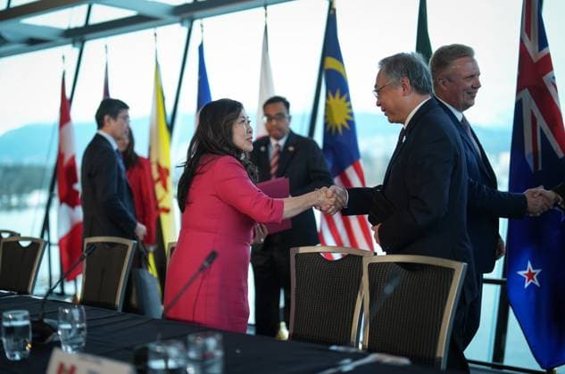 November 28, 2024, Vancouver, Bc, CANADA: Canada s Minister of Export Promotion, International Trade and Economic Development Mary Ng, left, shakes hands with Singapore Deputy Prime Minister and Minister for Trade and Industry Gan Kim Yong after the closing news conference at the Comprehensive and Progressive Agreement for Trans-Pacific Partnership (CPTPP) commission meeting, in Vancouver, on Thursday, November 28, 2024. Vancouver CANADA  - ZUMAc35_ 20241128_zaf_c35_099 Copyright: xDarrylxDyckx