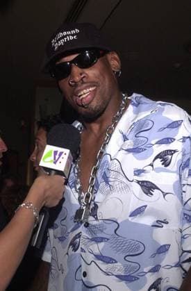 RECORD DATE NOT STATED Dennis Rodman at Rodman s 39th birthday party in Las Vegas, 06-03-00 , 10545056.jpg, male, hat, baseballcap, glasses, sunglasses, necklace, piercing, goatee, microphone, star,