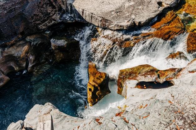 Creative Highlights World Hydraulic erosion of rock by river water, Glacier National Park Columbia Falls, Montana, United States CR_VBED241201-1585172-01