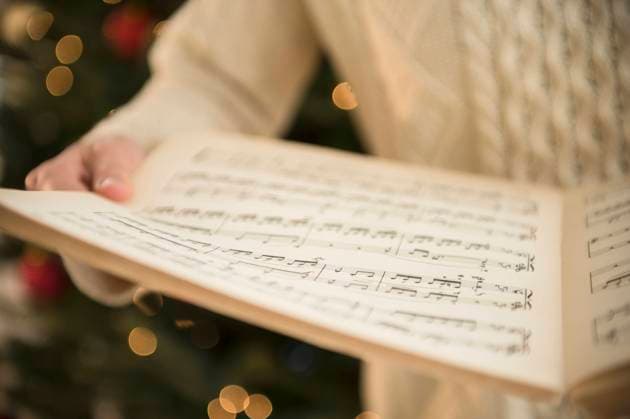 Studio Shot of woman holding sheet music at Christmas , 26.01.2023, model released, TTBB_ti02001771.jpg, Woman, Sheet Music, Music, Christmas, Celebration, Horizontal, Studio Shot, Close-Up, Part Of, Focus On Foreground, Holding, 30-34 Years, One Mid Adult Woman Only, One Person, Single Object, Performance, Tradition, Christmas Tree, Caucasian Ethnicity, Choir, Singing, Carols, Musical Symbol, Human Body Part, Sweater Copyright: xJamiexGrillx