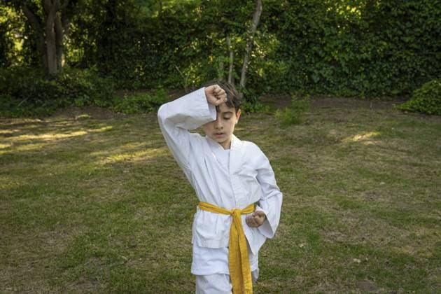 Creative Highlights Symbolbilder 783449156 Kind übt Taekwondo im Park Kid practicing Taekwondo in the park Copyright: imageBROKER MarianoxGaspar ibxmog11816065.jpg ,model released, Symbolfoto ,property released