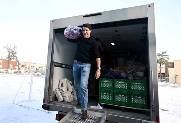 December 7, 2024, Montreal, Pq, Canada: Prime Minister Justin Trudeau helps to unload food from a truck which will be used to make Christmas baskets during a community event in Montreal, Saturday, December 7, 2024. Montreal Canada  - ZUMAc35_ 20241207_zaf_c35_018 Copyright: xGrahamxHughesx