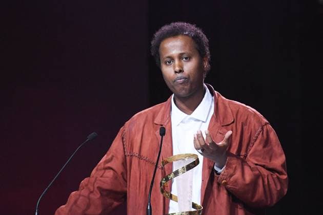 Marrakech Closing Ceremony Director Mo Harawe receives the award for The village next to Paradise attending the Closing Ceremony during the 21st Marrakech International Film Festival in Marrakech, Morocco on December 07, 2024. Photo by Aurore Marechal ABACAPRESS.COM Marrakech Morocco  Copyright: xMarechalxAurore ABACAx