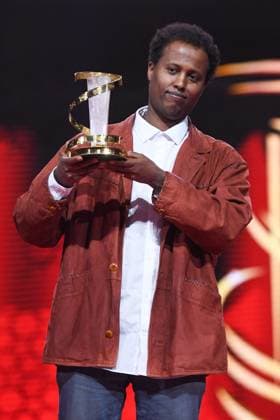 Marrakech Closing Ceremony Director Mo Harawe receives the award for The village next to Paradise attending the Closing Ceremony during the 21st Marrakech International Film Festival in Marrakech, Morocco on December 07, 2024. Photo by Aurore Marechal ABACAPRESS.COM Marrakech Morocco  Copyright: xMarechalxAurore ABACAx
