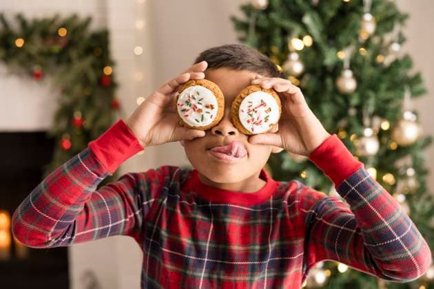 Creative Highlights Symbolfotos Boy covering eyes with christmas cookies and making a face Napa, California, United States CR_HOOX241209-1596684-01 ,model released, Symbolfoto ,property released