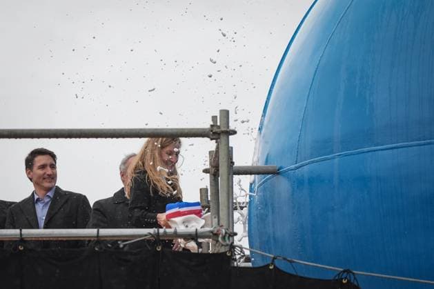 December 13, 2024, North Vancouver, Bc, CANADA: Prime Minister Justin Trudeau watches as HMCS Protecteur ship sponsor Teri McKinnon breaks a bottle of champagne on the bow of the new Royal Canadian Navy Joint Support vessel during a launch and naming ceremony at Seaspan Shipyards, in North Vancouver, B.C., on Friday, December 13, 2024. The ship is scheduled to be delivered to the Royal Canadian Navy in 2025. North Vancouver CANADA  - ZUMAc35_ 20241213_zaf_c35_088 Copyright: xDarrylxDyckx