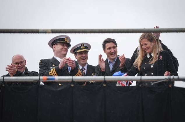 December 13, 2024, North Vancouver, Bc, CANADA: Seaspan Shipyards CEO John McCarthy, from left to right, HMCS Protecteur captain Landon Creasy, Royal Canadian Navy Commander, vice-admiral Angus Topshee and Prime Minister Justin Trudeau applaud after ship sponsor Teri McKinnon, front right, broke a bottle of champagne on the bow of the new Royal Canadian Navy Joint Support vessel, during a launch and naming ceremony at Seaspan Shipyards in North Vancouver, B.C., on Friday, December 13, 2024. The ship is scheduled to be delivered to the Royal Canadian Navy in 2025. North Vancouver CANADA  - ZUMAc35_ 20241213_zaf_c35_091 Copyright: xDarrylxDyckx