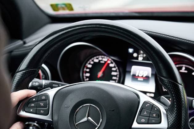 Bavaria, Germany - December 14, 2024: Close-up of the speedometer and steering wheel in a car. The speedometer shows over 100 km h. Symbolic image of speed limit and speed offenders *** Nahaufnahme des Tachometers und Lenkrads in einem Auto. Die Geschwindigkeitsanzeige zeigt über 100 km h. Symbolbild Tempolimit und Temposünder