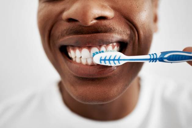 Creative Highlights Symbolfotos Happy, black man and teeth with toothbrush for dental hygiene, cleaning or oral care at home. Closeup, young African or male person with smile and mouth for tooth whitenening or morning routine. model released property released Copyright: xwww.peopleimages.comx